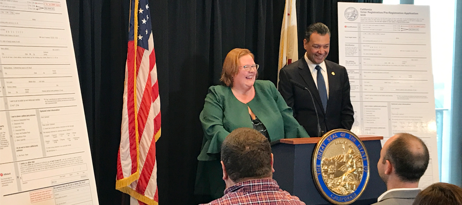 LWVC ED Melissa Breach speaks about new voter registration form at press event on 4/5/18.